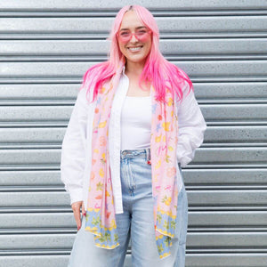 Model wearing the Sunday Picnic Modal Long Scarf draped over a white shirt and jeans
