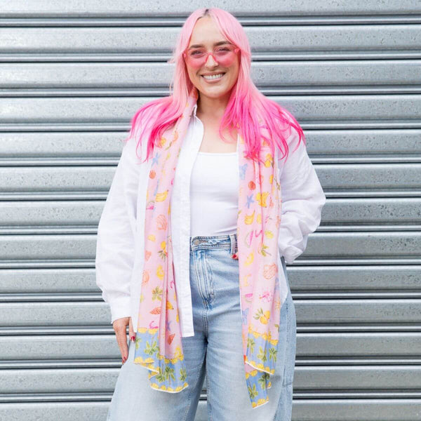 Model wearing the Sunday Picnic Modal Long Scarf draped over a white shirt and jeans