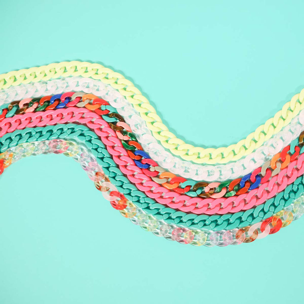 Multicoloured chain linked glasses chain flat lay. 