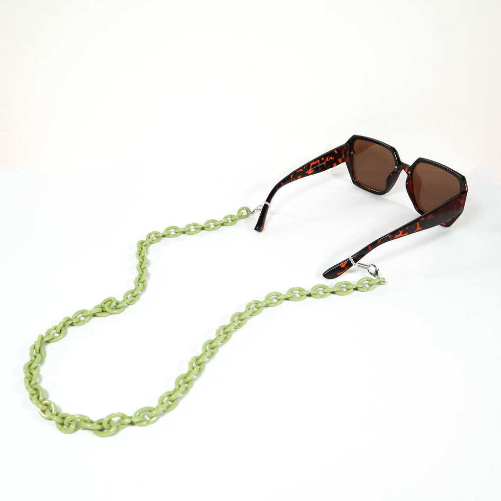 Olive green coloured sunglass/ mask chain attached to a tortoise shell sunglasses. 